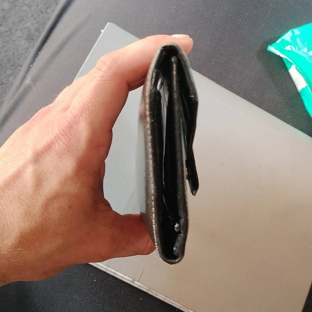 Christian Dior Vintage black leather wallet.